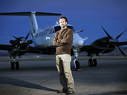 man standing in front of airplane