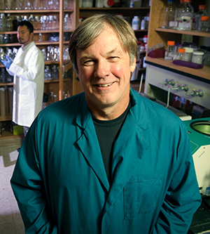 man in a blue lab coat