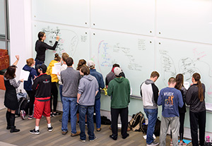 people at a whiteboard