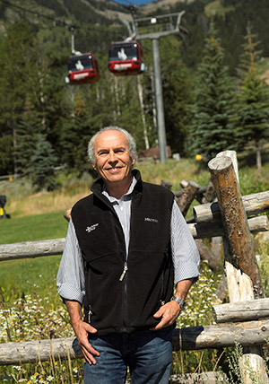 man with chair lifts in the background