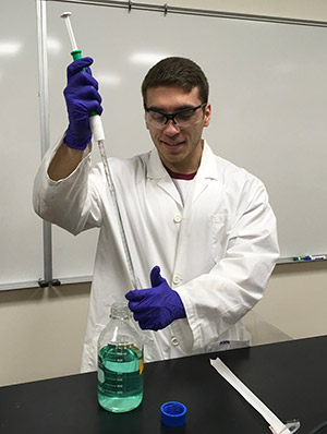 man in lab coat working in a lab