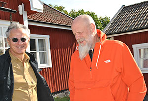 two men standing outside