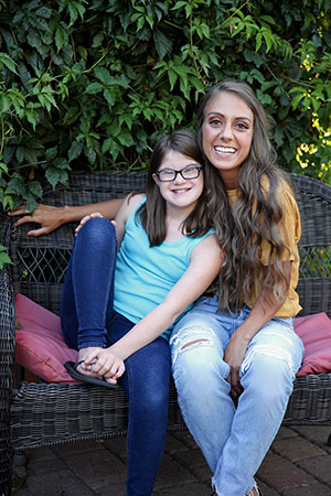 a woman and a girl sitting together