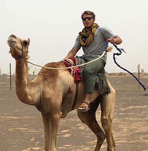 man riding a camel