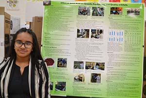 girl standing with poster