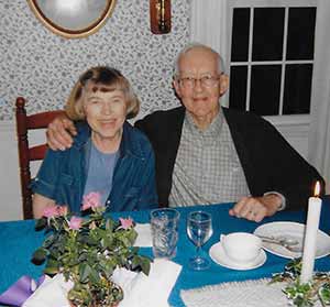 woman and man at dinner table with candle