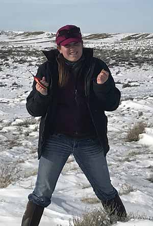 woman standing in a snowy field