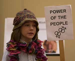 child holding a poster sign