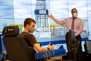 man sitting in a simulation control chair