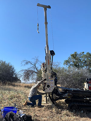 people setting up a large piece of equipment