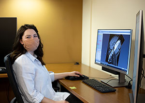 woman sitting at a computer