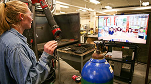 woman with screen of virtual students