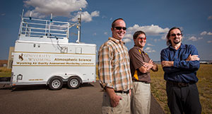 people standing near a trailer