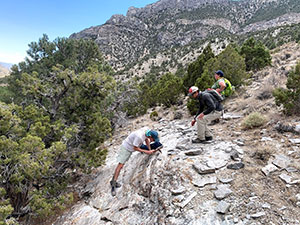 people on a rocky slope