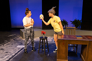 Two female UW students rehearse a scence from a play.