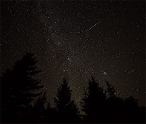 night sky with meteor falling