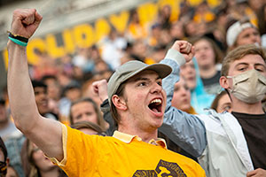 person cheering in a crowd