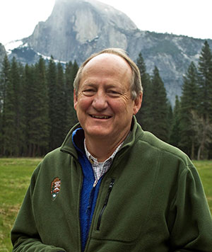 man standing outdoors with mountain in background