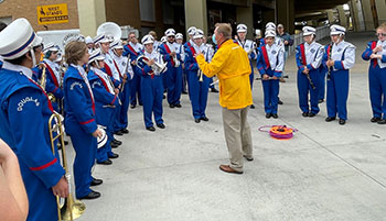 marching band standing under the stadium