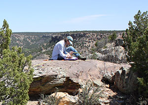 person sitting on rocks