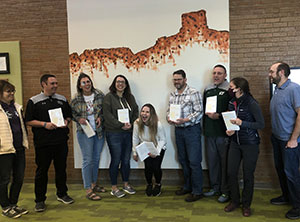 group of people laughing and posing for photo