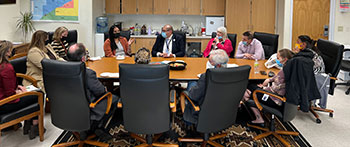 people meeting around a large table