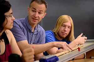 man talking with two people