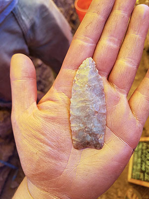 an open palm with a stone point in it