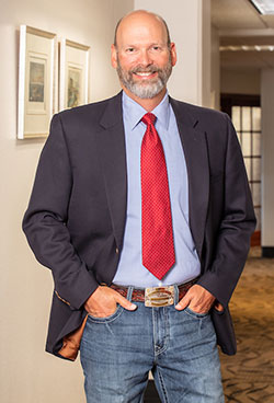 man standing in a hallway