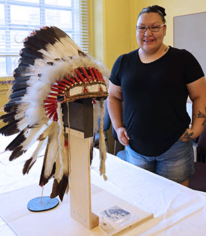 woman standing near a headdress