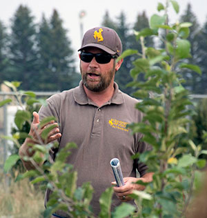 man standing amid plants