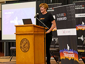 woman speaking at a podium