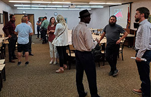 people talking in a large room