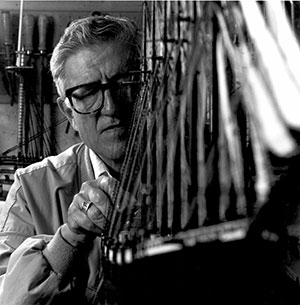 man working on a model ship