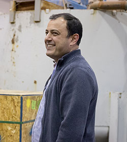 man standing in front of liquid tank