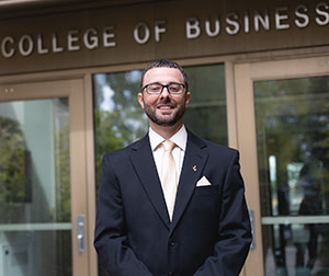 man standing in front of building