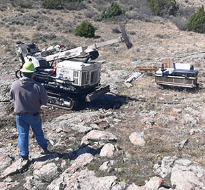 man with heavy equipment and scientific equipment outdoors