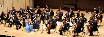 orchestra performing on a stage