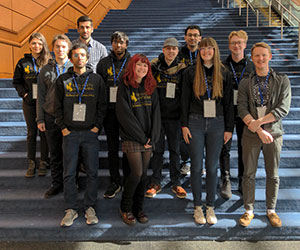 group of people standing on stairs