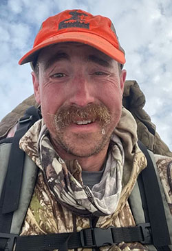 head photo of a man with frost on his moustache