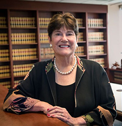 woman seated at a desk