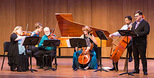 small group of musicians on stage