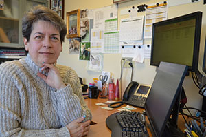 woman at a desk with a computer