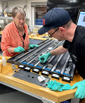 two people with rock samples