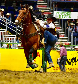 woman dismounting horse on the run