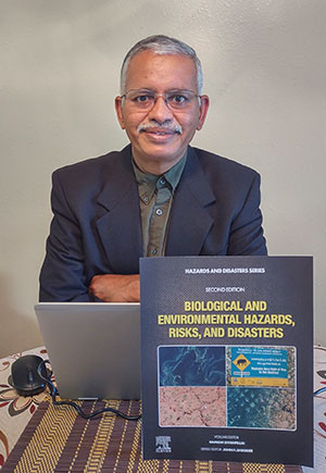 man posing with a book