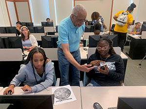 people in a classroom with computers