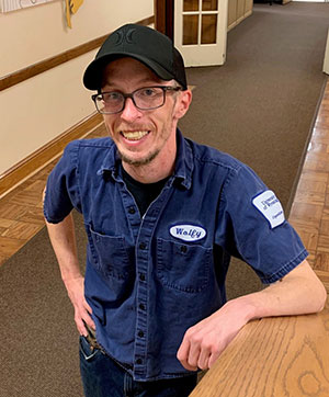 man posing for the camera in a hallway