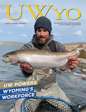 magazine cover with a photo of a man holding a large fish