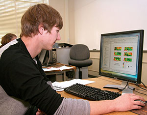 man sitting at a computer